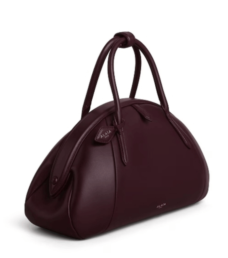 ALAÏA Bordeaux PURSE TOP HANDLE BAG IN CALFSKIN