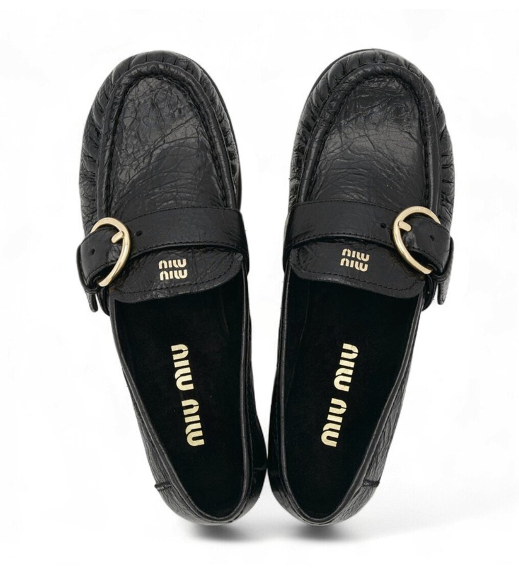 Miu Miu Black leather loafers with crinkled vintage-effect 