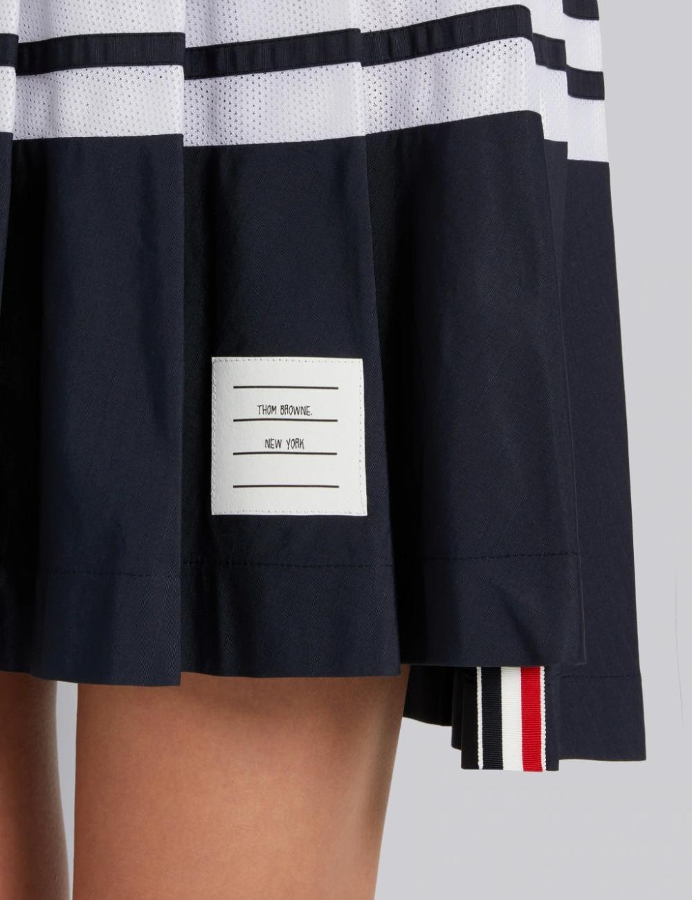 NAVY RIPSTOP MESH 4-BAR DROPPED BACK PLEATED MINI SKIRT