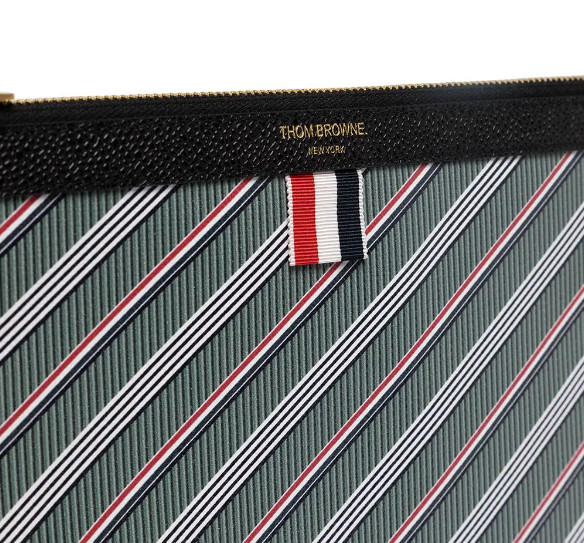 Additional production Monogram Coated RWB Stripe Clutch Small